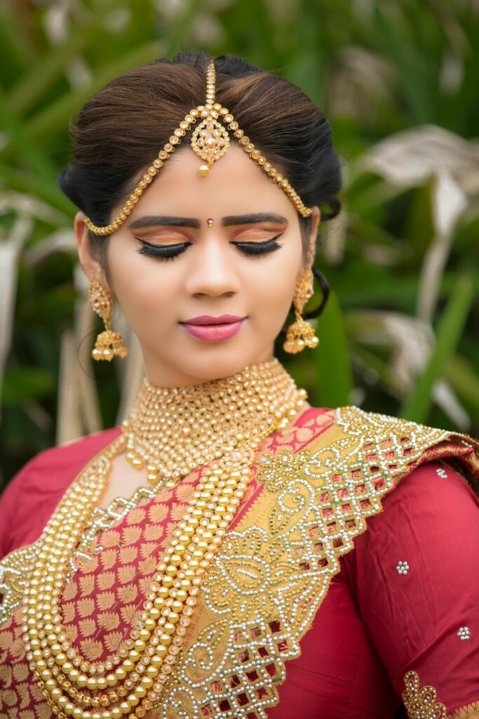ndian bride wearing heavy gold jewellery during wedding season gold buying in India